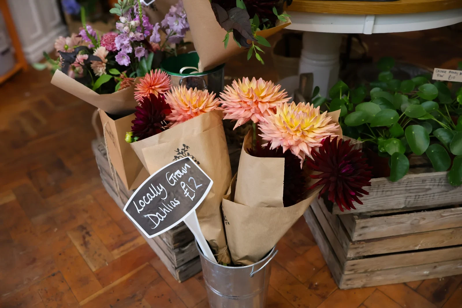 Fresh flowers wrapped for display at Roots